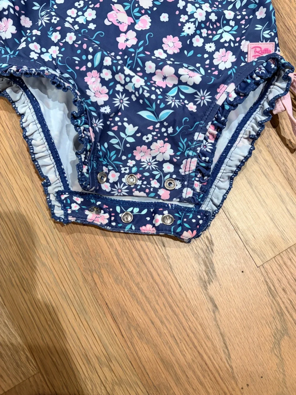 Rufflebutts toddler girl floral rashguard bathing suit with snap closure